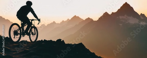 Silhouette of a cyclist on a mountain trail close up, focus on, copy space Earthy tones with a rugged texture Double exposure silhouette with mountain range photo