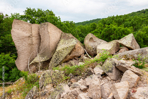 Impressive split megalithic rock formations on the hill above Beglik Tash, a prehistoric rock sanctuary on the Bulgarian Black Sea coast near Primorsko, Province of Burgas  photo