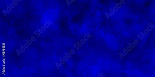 Dark blue background with clouds,Light ink canvas for modern creative grunge design.brush painted blue background used in weeding card,grungy background for decoration,