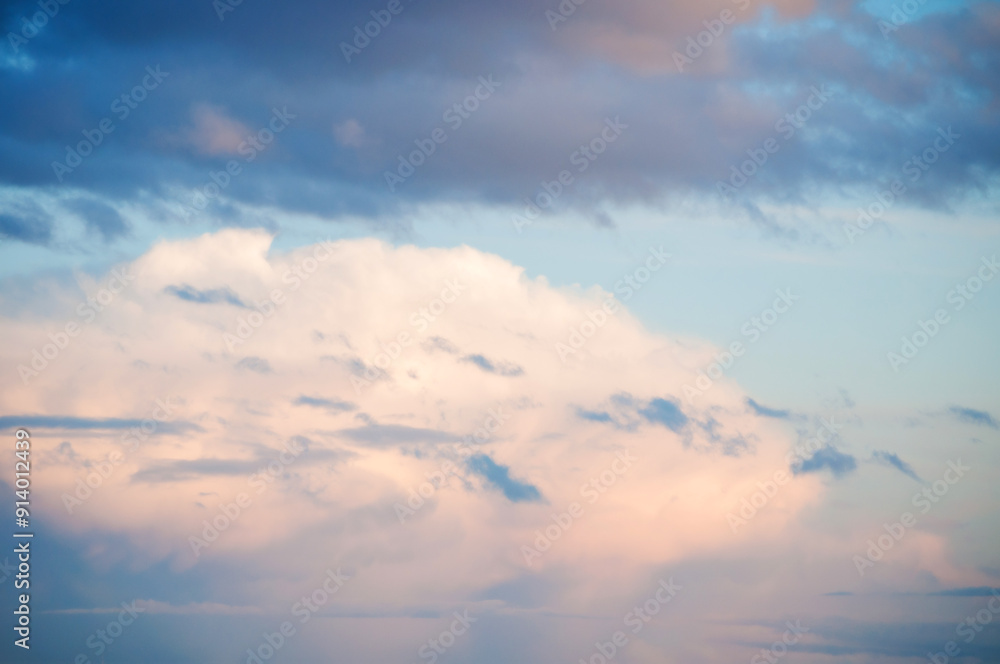 Blue sky background with white dramatic colorful clouds and soft sunlight Blue sky background with white dramatic colorful clouds and soft sunlight