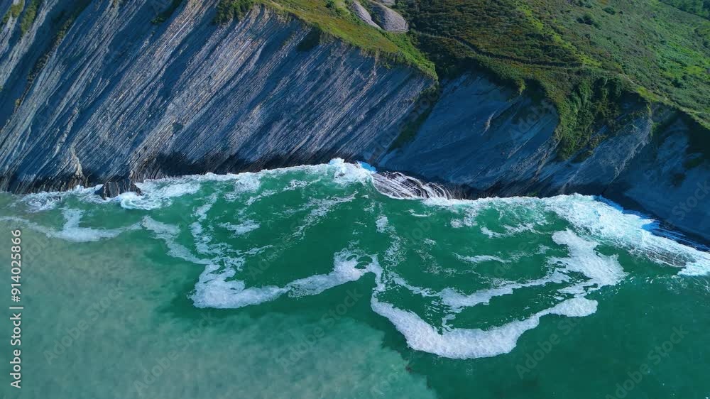 Flysch between Punta Mendata and Sakoneta beach at low tide. Aerial view from a drone on the Cantabrian Coast in Deva. Cantabrian Sea. Gipuzkoa Province. Basque Country. Spain. Europe Flysch between Punta Mendata and Sakoneta beach at low tide. Aerial view from a drone on the Cantabrian Coast in Deva. Cantabrian Sea. Gipuzkoa Province. Basque Country. Spain. Europe
