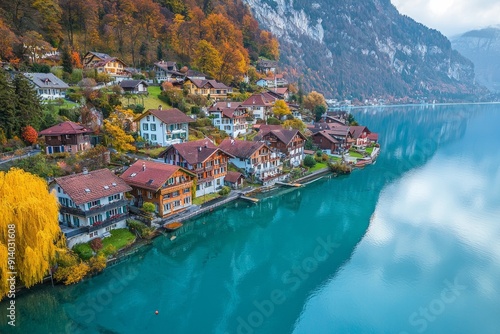 Overhead perspective of a serene lakeside town in Switzerland, where the crystal-clear water reflects the colorful houses and surrounding mountains.