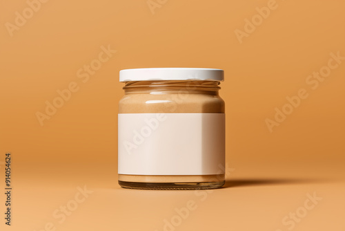 Peanut butter glass jar mockup with blank label isolated on yellow background