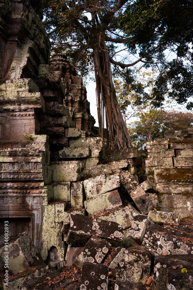 Angkor Thom, ancient temple ruins in Cambodia jungle with tree roots Angkor Thom, ancient temple ruins in Cambodia jungle with tree roots