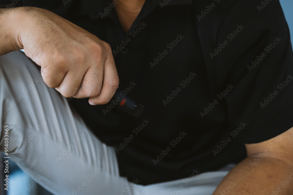 Man Vaping with Electronic Cigarette. The dangers of e-cigarettes Man Vaping with Electronic Cigarette. The dangers of e-cigarettes