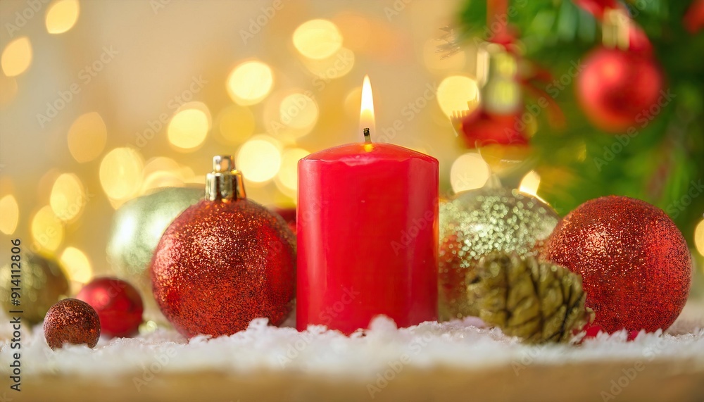 Cozy Christmas scene with red candle and ornaments Cozy Christmas scene with red candle and ornaments