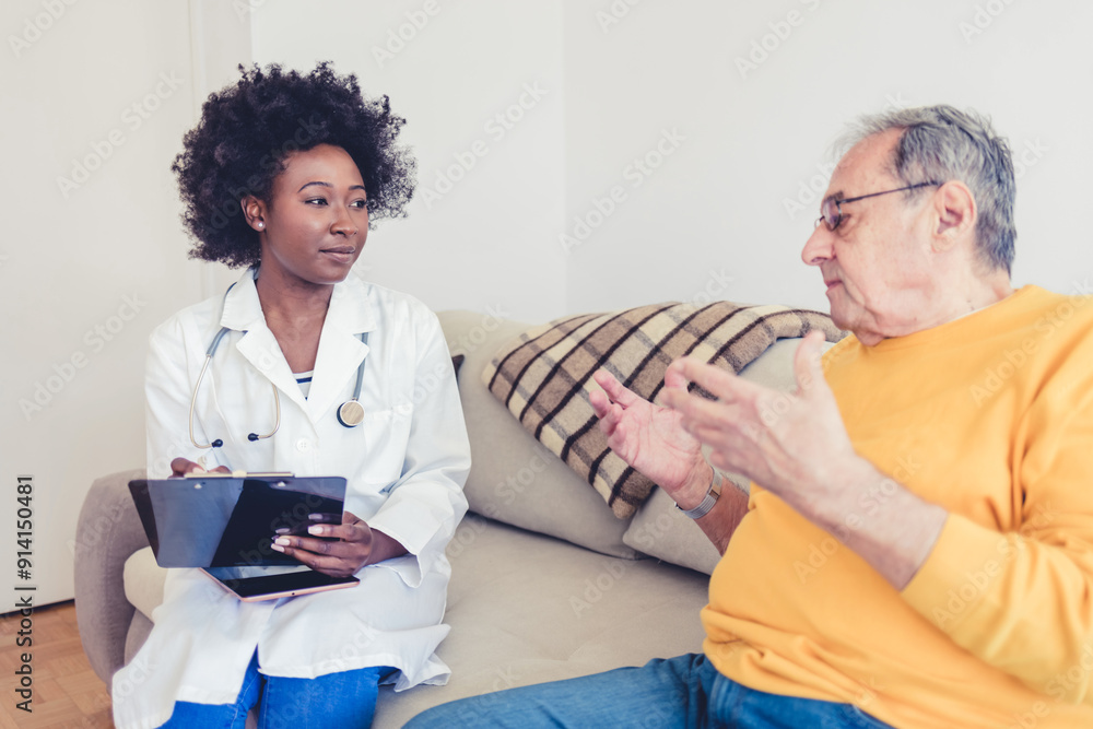 Obraz premium Elderly care, doctor and retired man on sofa for discussion, routine check up or diagnosis in living room. Female carer, senior patient and consultation on couch for healthcare, wellbeing or medicare