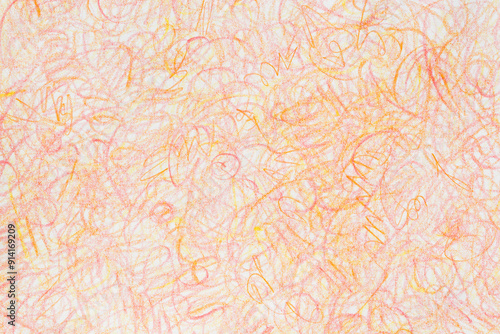 orange crayon doodles on paper background