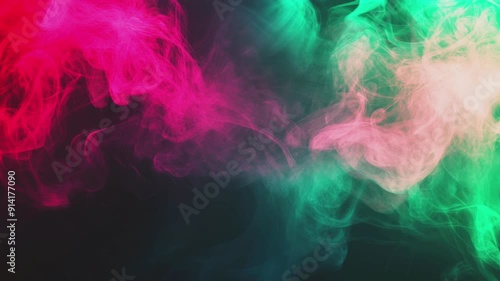 Abstract pink and green smoke swirls on black background.