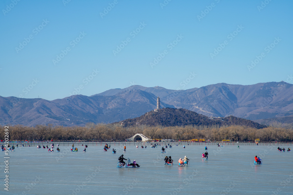 Skating tourists on Kunming Lake in Summer Palace, Beijing.
