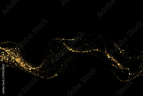 Scattered golden particles on dark background. Holiday background or design element. New Year and Christmas