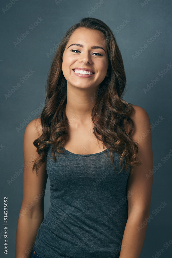 Hair care, portrait and woman with confidence in studio for collagen treatment, shine and satisfaction. Relax, makeup and female person with smile for cosmetic, shampoo and pride on blue background Hair care, portrait and woman with confidence in studio for collagen treatment, shine and satisfaction. Relax, makeup and female person with smile for cosmetic, shampoo and pride on blue background