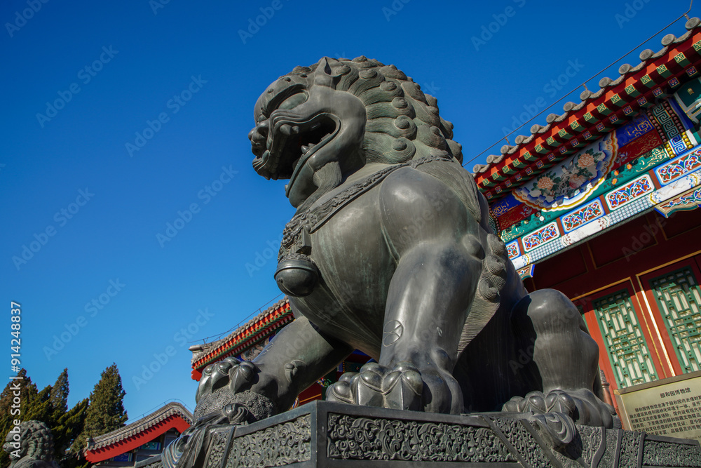 Bronze lion sculpture outside the gate of Summer Palace Museum in Beijing. Bronze lion sculpture outside the gate of Summer Palace Museum in Beijing.