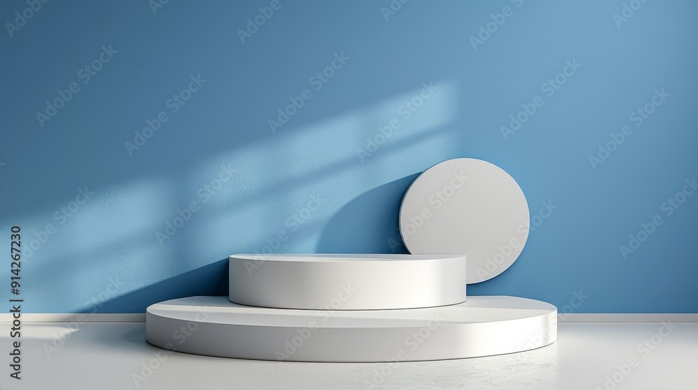 Minimalist display scene with round platforms and a blue wall, perfect for showcasing products or artistic presentations. Minimalist display scene with round platforms and a blue wall, perfect for showcasing products or artistic presentations.