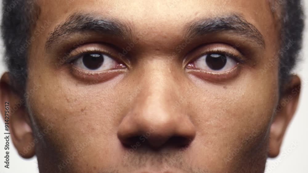 Man Eyes Open Close Up in Slow Motion on White Background Man Eyes Open Close Up in Slow Motion on White Background