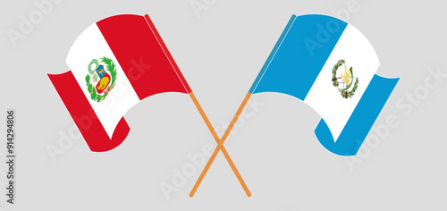 Crossed and waving flags of Peru and Republic of Guatemala