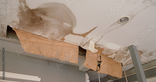 Ceiling panels with fungus outside house from water pipes damaged or rainy leaked. Office building or house problem for house service.