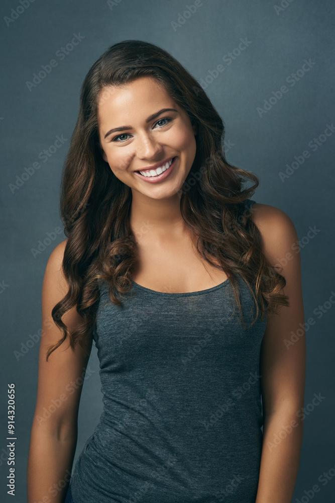 Hair care, happy and portrait of woman in studio for shampoo treatment, shine and satisfaction. Relax, makeup and female person with smile for collagen, confidence or cosmetic glow on blue background Hair care, happy and portrait of woman in studio for shampoo treatment, shine and satisfaction. Relax, makeup and female person with smile for collagen, confidence or cosmetic glow on blue background