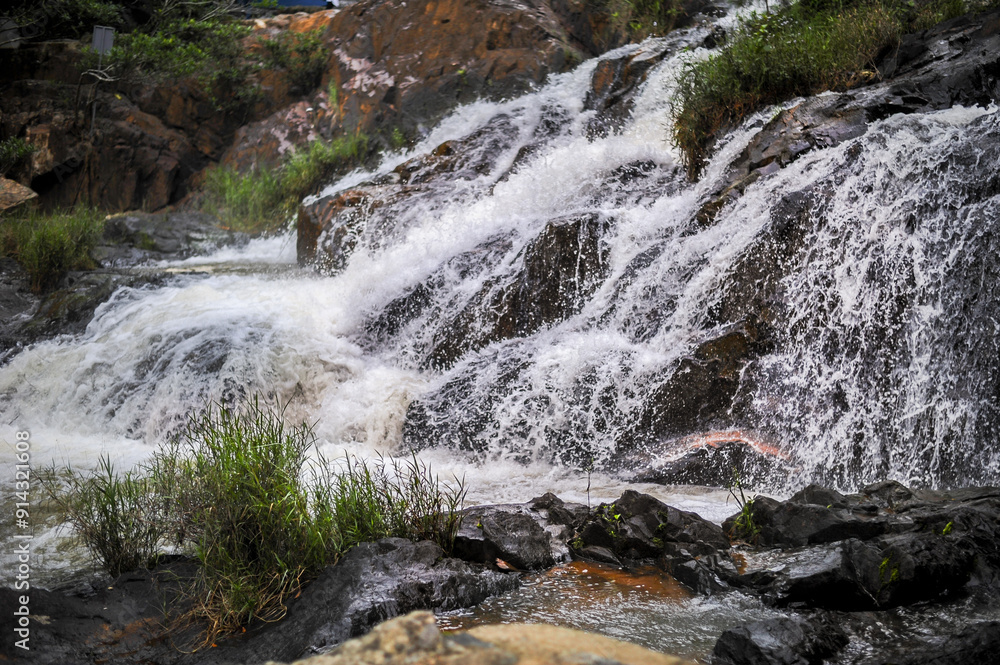 powerful wide waterfall with white foaming water powerful wide waterfall with white foaming water