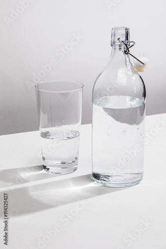 Clear glass water bottle with glass
