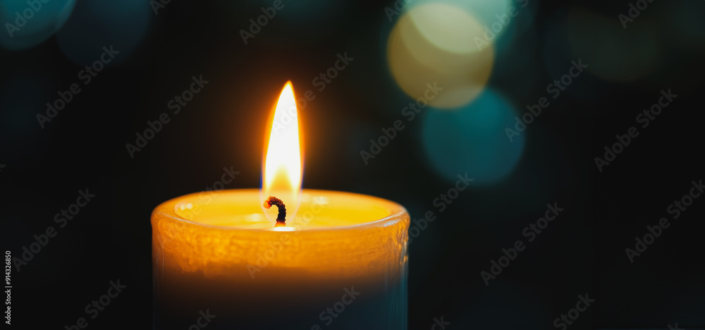A Single Flame Flickers Gently on a Candle During a Quiet Evening Gathering A Single Flame Flickers Gently on a Candle During a Quiet Evening Gathering