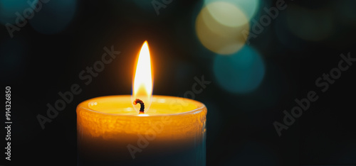 A Single Flame Flickers Gently on a Candle During a Quiet Evening Gathering