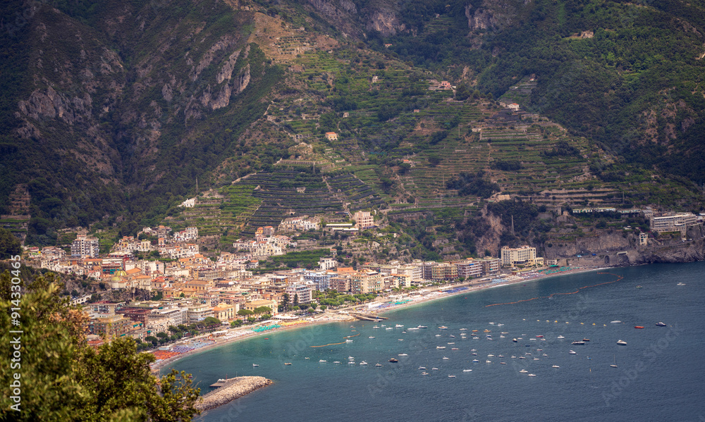 Scenic Coastal Town with Mountain Backdrop and Clear Blue Waters, Amalfi coast line aerial view, Drone shot, Italy, Europe