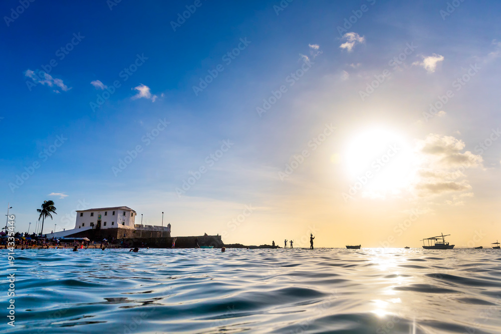 Fototapeta premium Sunset at Baía de Todos os Santos and beautiful blue sea