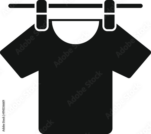 Black t shirt drying on a clothesline after being washed
