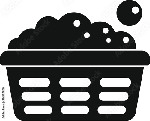 Black and white silhouette of a plastic laundry basket full of clothes, water, soap, and suds