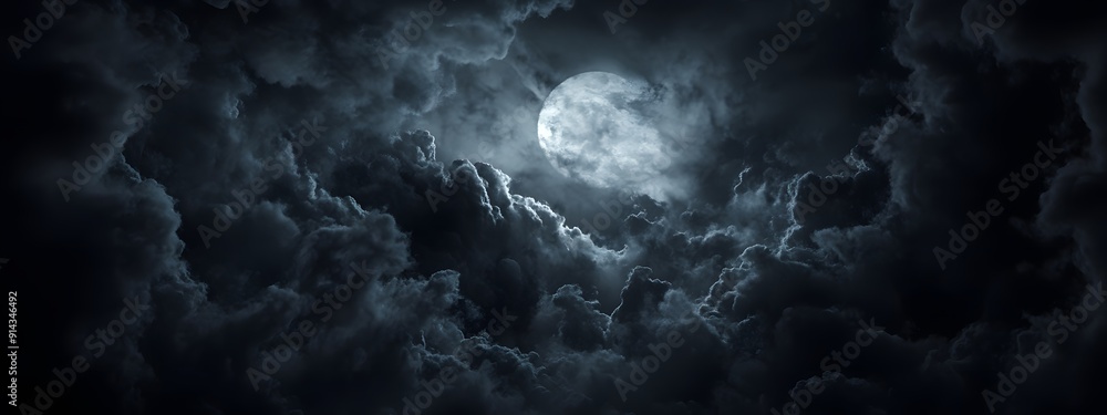 Fototapeta premium In the dark night, clouds in front of moonlight, creating an eerie atmosphere. The clouds form intricate patterns that resemble shadows and designs from darkness