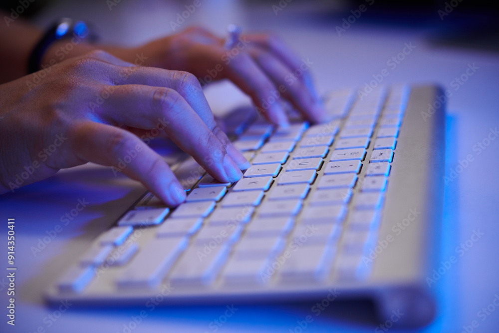 Close-up view of hands typing on sleek modern keyboard with soft blue ambient lighting creating technology-focused atmosphere. Scene highlights tech engagement Close-up view of hands typing on sleek modern keyboard with soft blue ambient lighting creating technology-focused atmosphere. Scene highlights tech engagement
