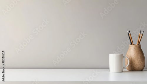 Minimalist Workspace with White Desk Setup and Simple Wooden Vase on Grey Wall Background