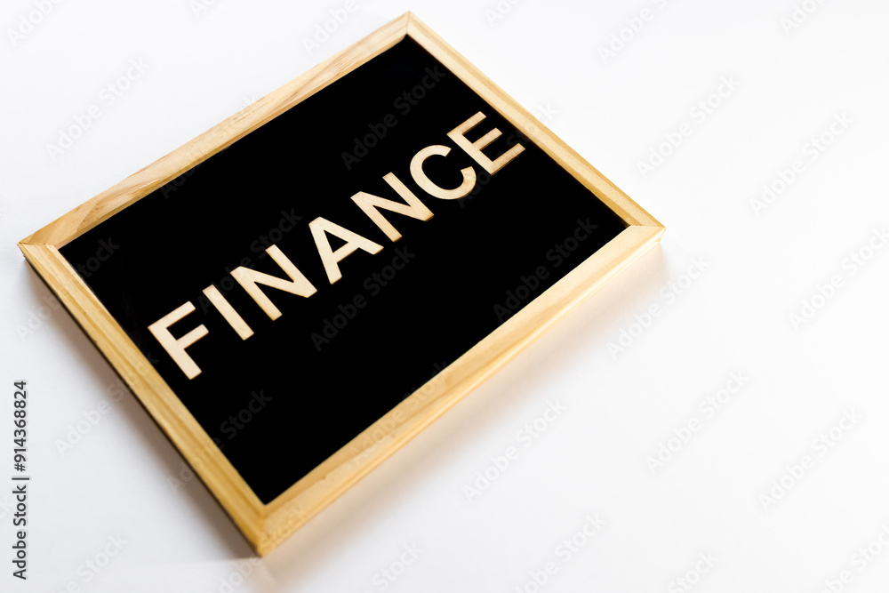 Wooden frame with white background with text - Finance. Top view. For backgrounds and presentations. Finance Wooden frame with white background with text - Finance. Top view. For backgrounds and presentations. Finance