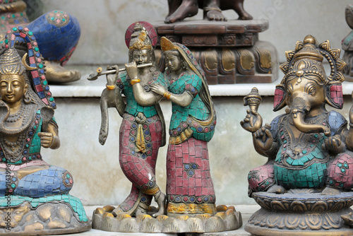 Bronze religious figures: Radha Krishna, Shiva, Ganesha. photo