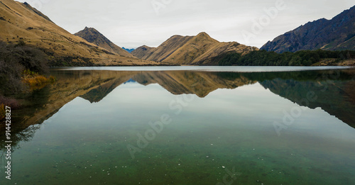 Winter Majesty Snow-Capped Peaks, Reflective Lakes, and Scenic Views of Queenstown and Coronet Peak New Zealand South Island Nature photo