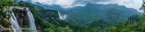 Waterfall in a Lush Mountain Valley