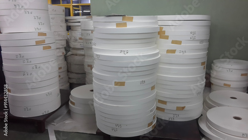 Kolkata, West Bengal, India - 6th May 2021 : White Paper Reels are stacked up before being used as bottom of Paper cups. Indian paper cup making industry is growing.