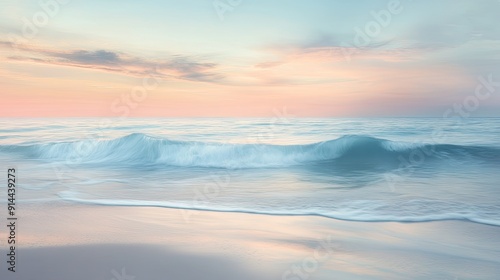 A tranquil beach at sunrise, with gentle waves lapping at the shore and the sky painted with soft morning colors.