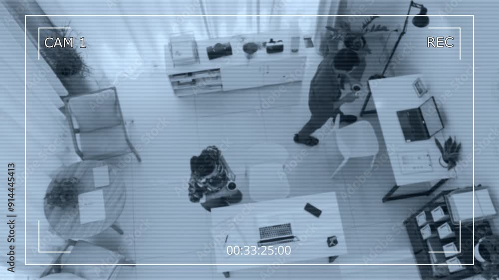 CCTV shot of two colleagues discussing business plan after coffee break in modern startup office CCTV shot of two colleagues discussing business plan after coffee break in modern startup office
