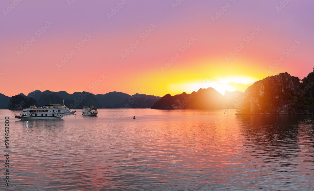 Naklejka premium Sunset In The Morning On The harbour In Ha long Bay with fisboat - Vietnam