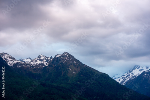 Landscape of valley with fog in the austrian village Bramberg near the mountain Wildkogel photo