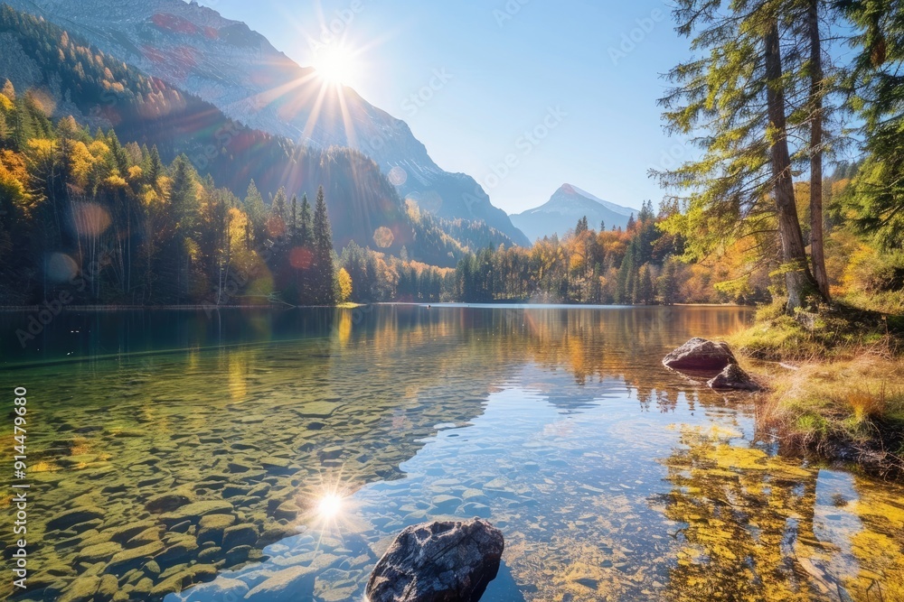 Naklejka premium Tranquil Mountain Lake with Clear Water and Autumn Colors