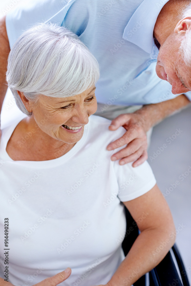 Obraz premium Wheelchair, hug and happy old couple in hospital for healthcare, visit and hope for recovery. Senior, elderly man or woman with disability with love, care or empathy in clinic for kindness or comfort