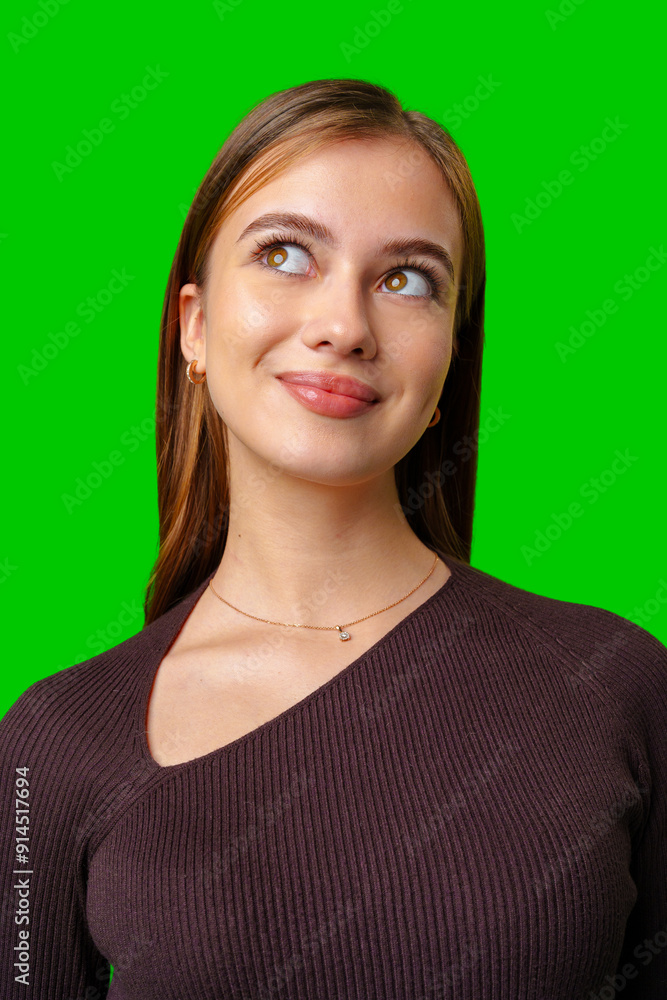 Fototapeta premium Young Woman Wearing Brown Sweater Looks Up