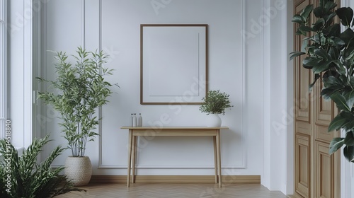 a simple clean entryway with a blank picture frame hanging above the entry table photo