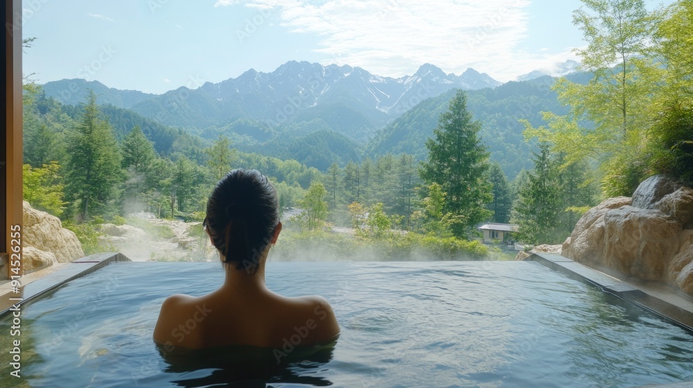 Serene Woman Relaxing in Natural Outdoor Onsen with Mountain View Serene Woman Relaxing in Natural Outdoor Onsen with Mountain View