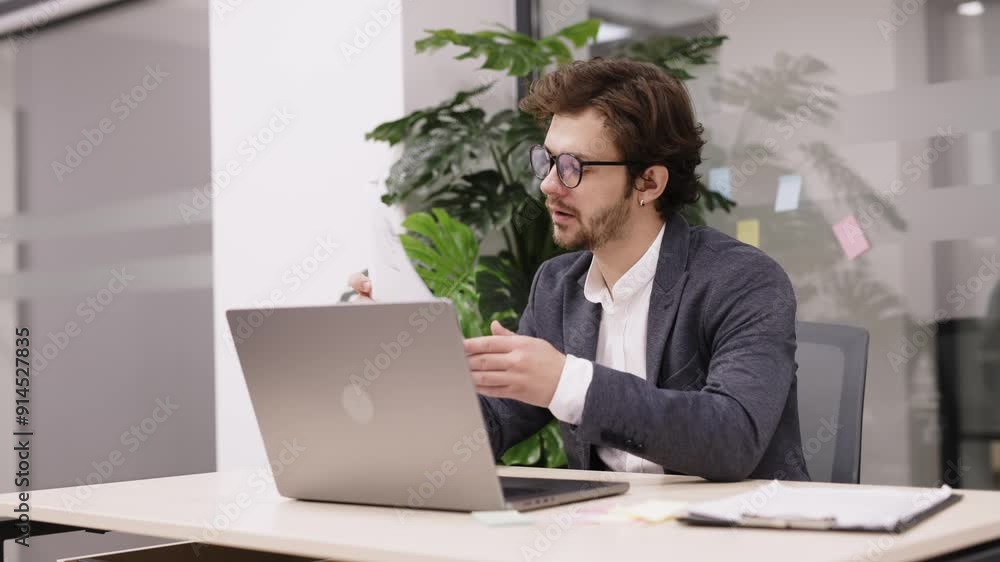 Focused trader working on a laptop in a modern office, analyzing market trends and planning investment strategies. Perfect for illustrating financial growth and professional trading. Focused trader working on a laptop in a modern office, analyzing market trends and planning investment strategies. Perfect for illustrating financial growth and professional trading.