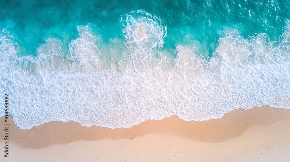 Aerial view of turquoise waves crashing on sandy shore Aerial view of turquoise waves crashing on sandy shore