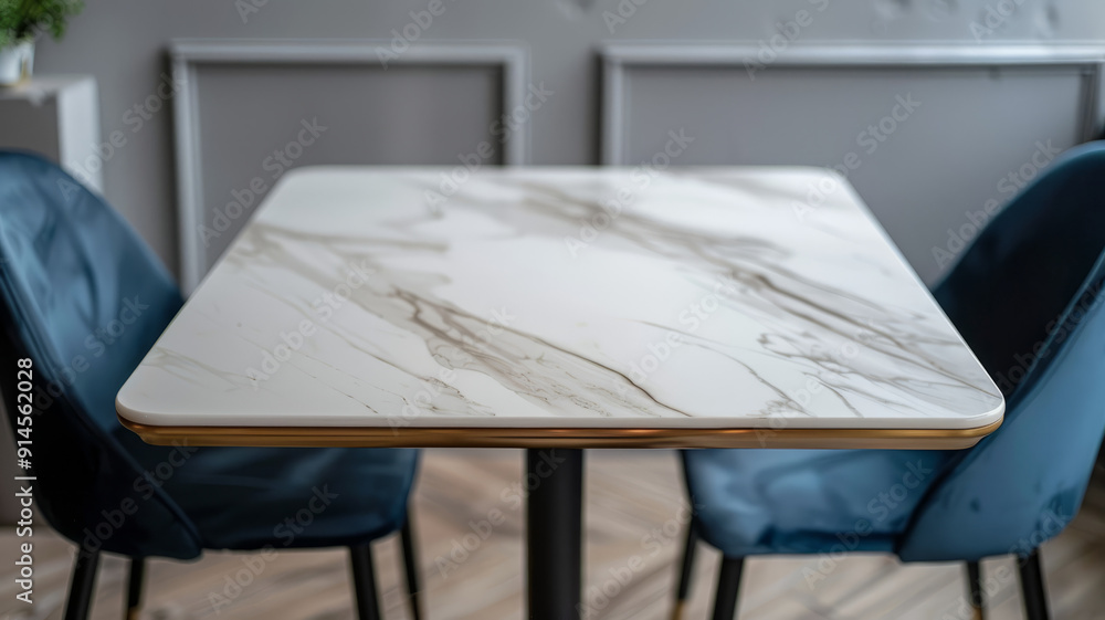 Obraz premium Marble table with two blue chairs in modern interior
